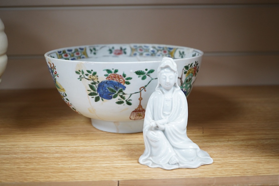 A Chinese famille verte bowl, Kangxi period and a white glazed figure of Guanyin, bowl 22cm diameter. Condition - figure good, bowl poor